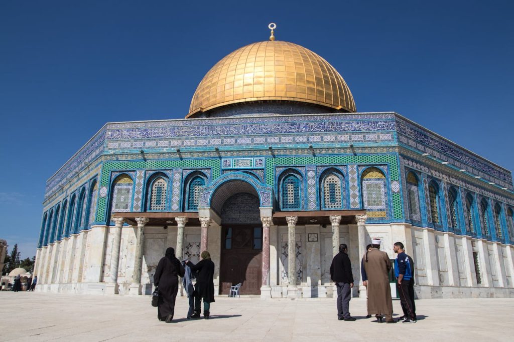 Iconic Dome of the Rock with golden dome in Jerusalem, Israel, showcasing Islamic architecture under a clear blue sky.